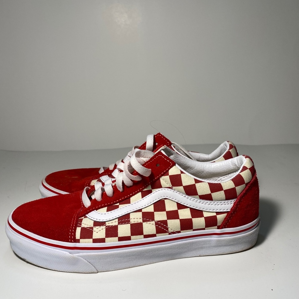 Red low top checkered vans